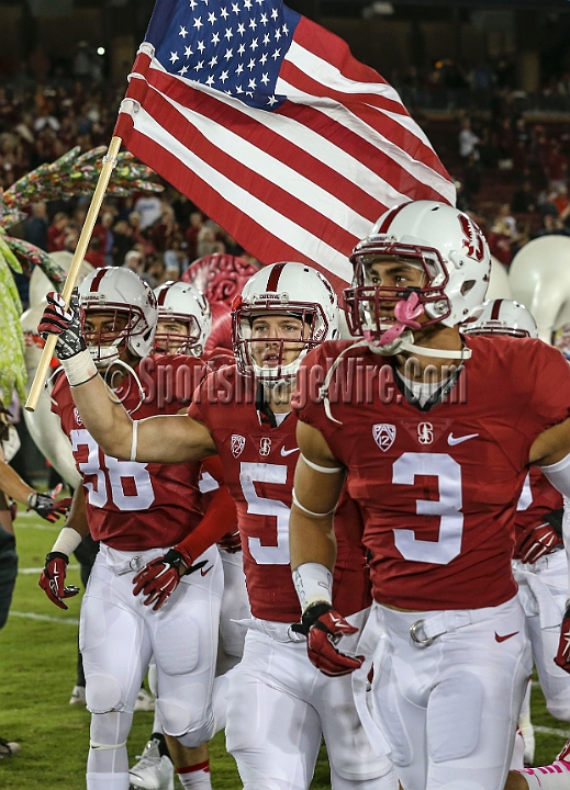2015StanWash-025.JPG - Oct 24, 2015; Stanford, CA, USA; Stanford Cardinal team members running back Christian McCaffrey (5), cornerback Ra'Chard Pippens (38) and wide receiver Michael Rector (3) lead the team on the field for game  against the Washington Huskies at Stanford Stadium. Stanford beat Washington 31-14.